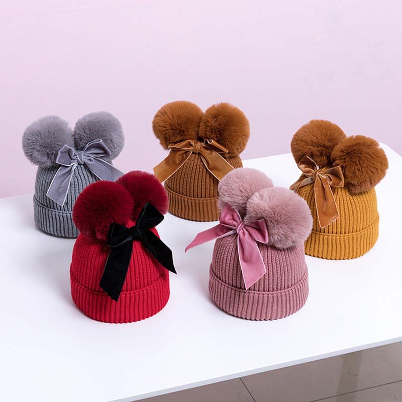 Korean version double fur ball bow cute knitted hat for boys and girls, autumn and winter with cotton thick warm baby hat