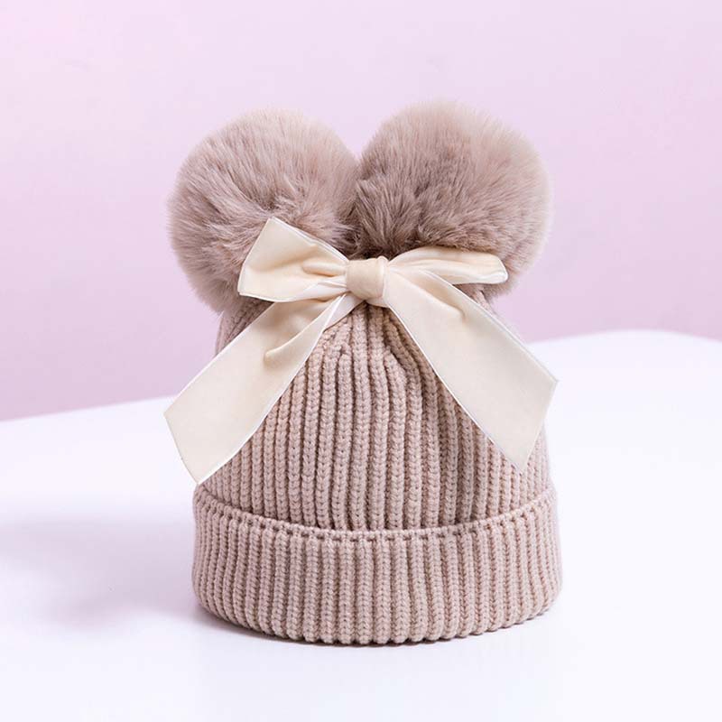 Korean version double fur ball bow cute knitted hat for boys and girls, autumn and winter with cotton thick warm baby hat