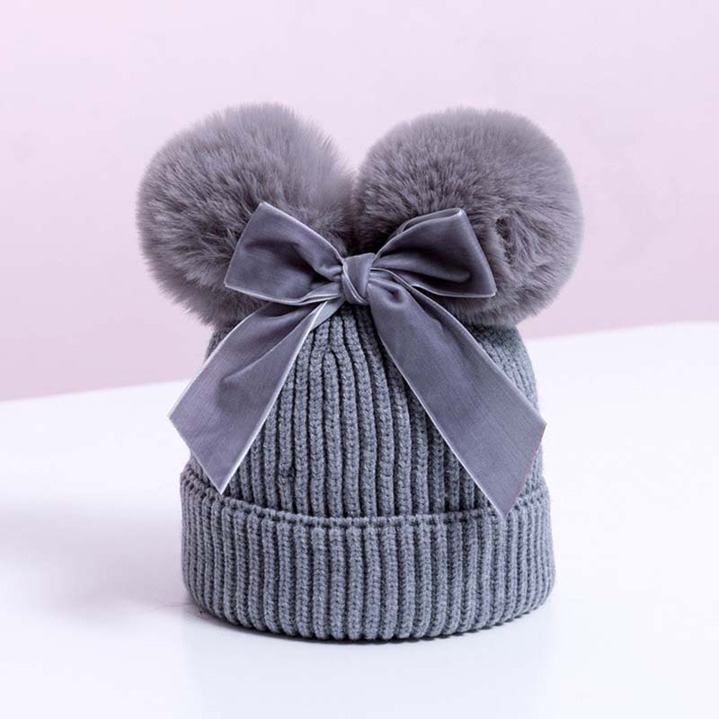 Korean version double fur ball bow cute knitted hat for boys and girls, autumn and winter with cotton thick warm baby hat