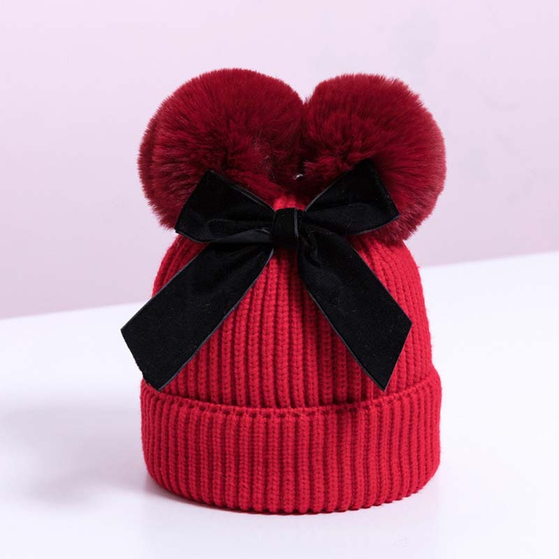 Korean version double fur ball bow cute knitted hat for boys and girls, autumn and winter with cotton thick warm baby hat