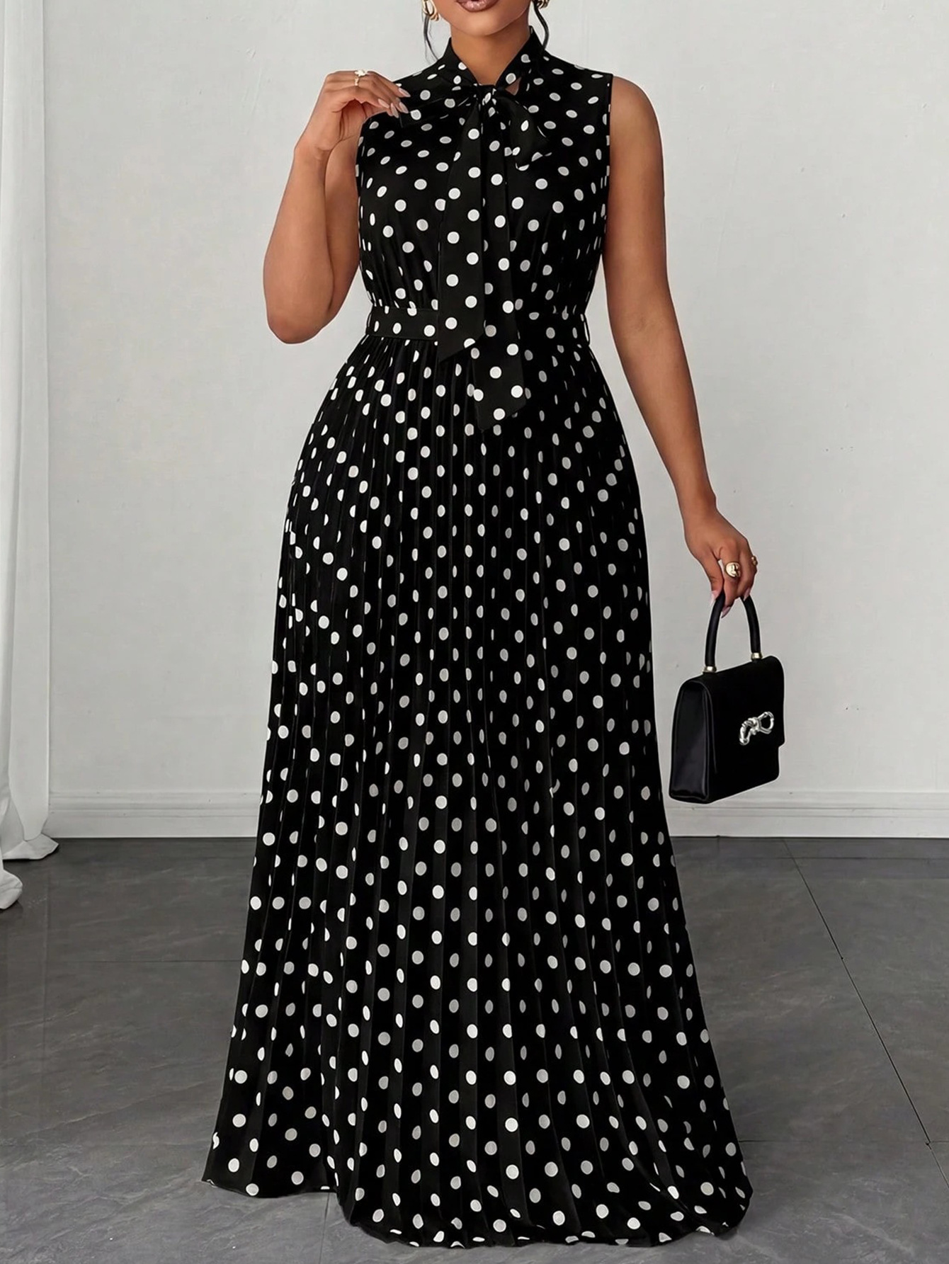 Large women's dress with polka dots and sleeveless straps, mid length dress