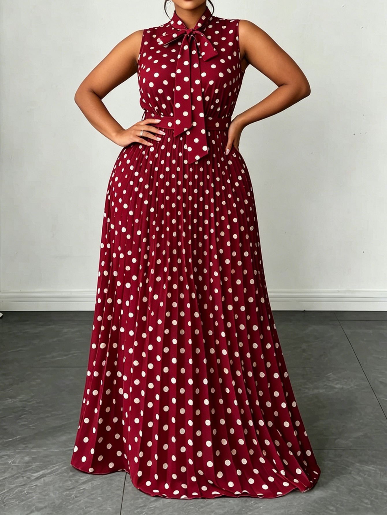 Large women's dress with polka dots and sleeveless straps, mid length dress