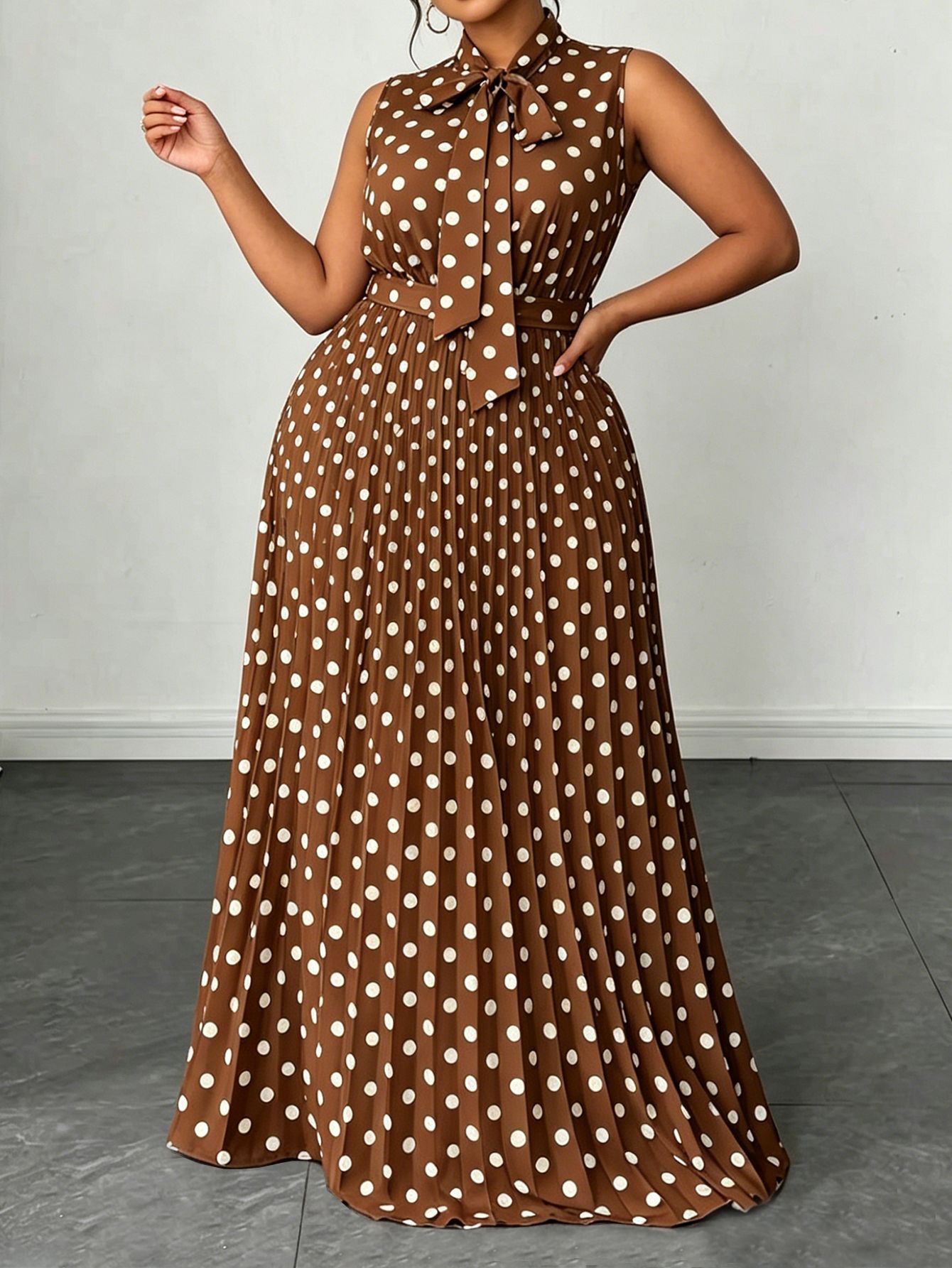 Large women's dress with polka dots and sleeveless straps, mid length dress
