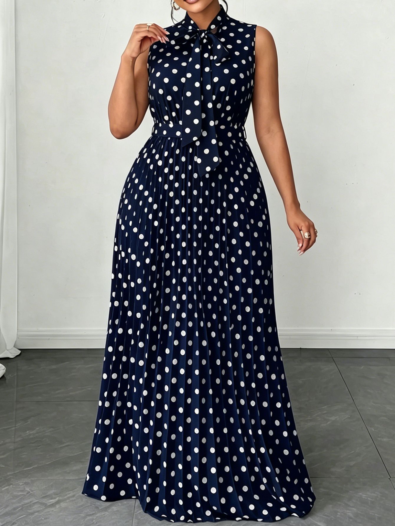Large women's dress with polka dots and sleeveless straps, mid length dress