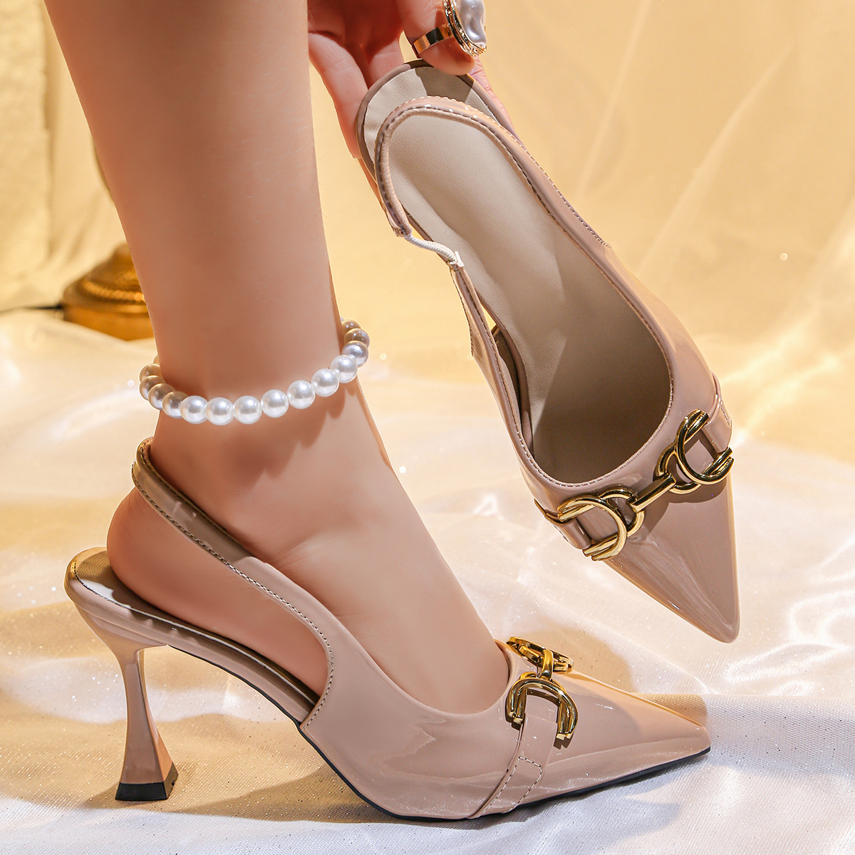 New women's shoes in summer: solid color pointed metal buckle, shallow mouth, empty stiletto sandals and high-heeled shoes.