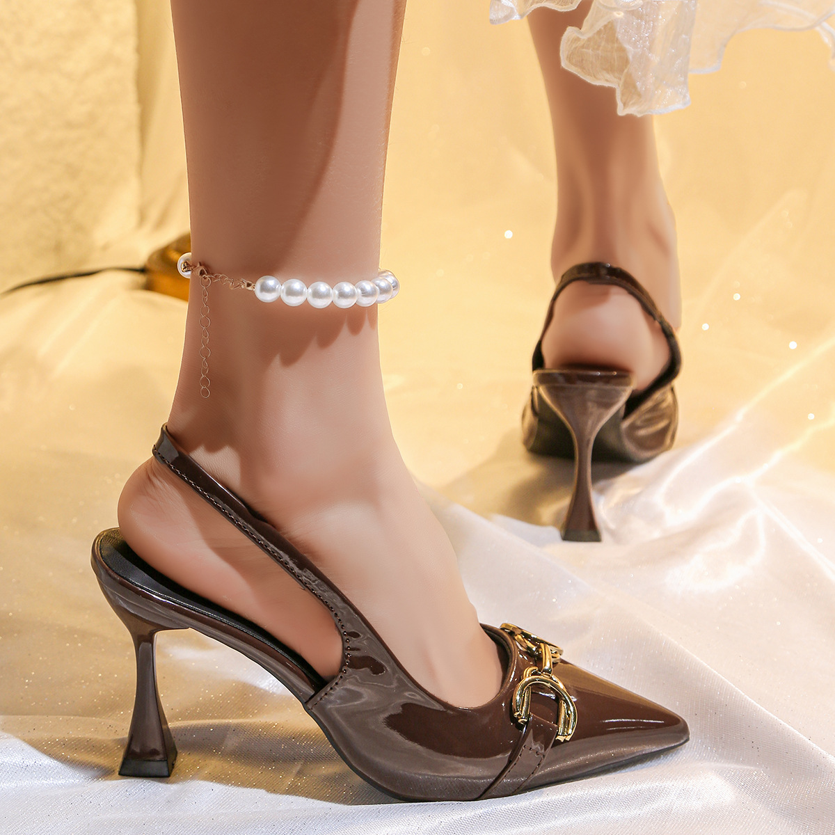 New women's shoes in summer: solid color pointed metal buckle, shallow mouth, empty stiletto sandals and high-heeled shoes.