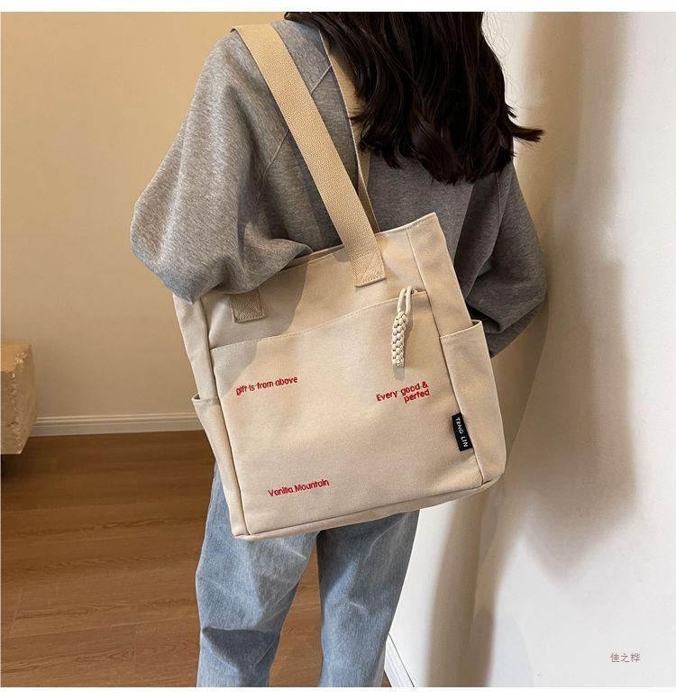 Canvas bag women's men's new trendy embroidery letter handbag student large capacity single shoulder tote bag