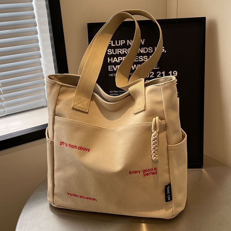 Canvas bag women's men's new trendy embroidery letter handbag student large capacity single shoulder tote bag