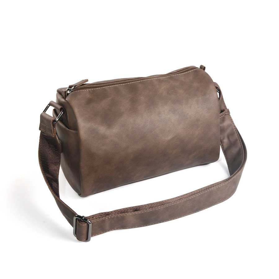 New cylindrical shoulder bag  fashionable and simple casual backpack  Korean version trendy men's bag  diagonal cross bag