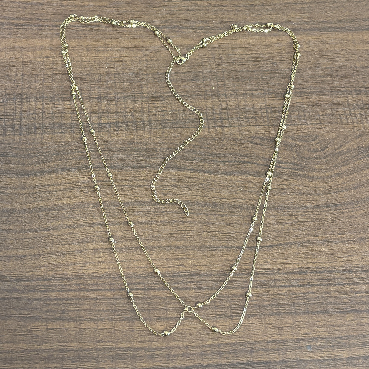 Sleek Two-Tier Waist Chain: 18K Gold-Plated Stainless Steel Bead + Ball Chain with Signature Cross Clip Accen