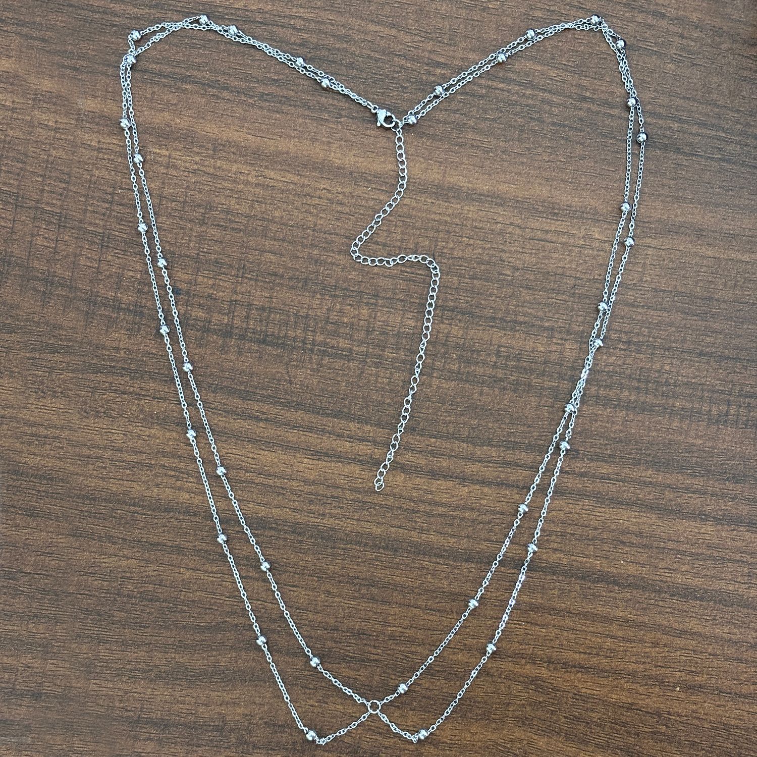 Sleek Two-Tier Waist Chain: 18K Gold-Plated Stainless Steel Bead + Ball Chain with Signature Cross Clip Accen