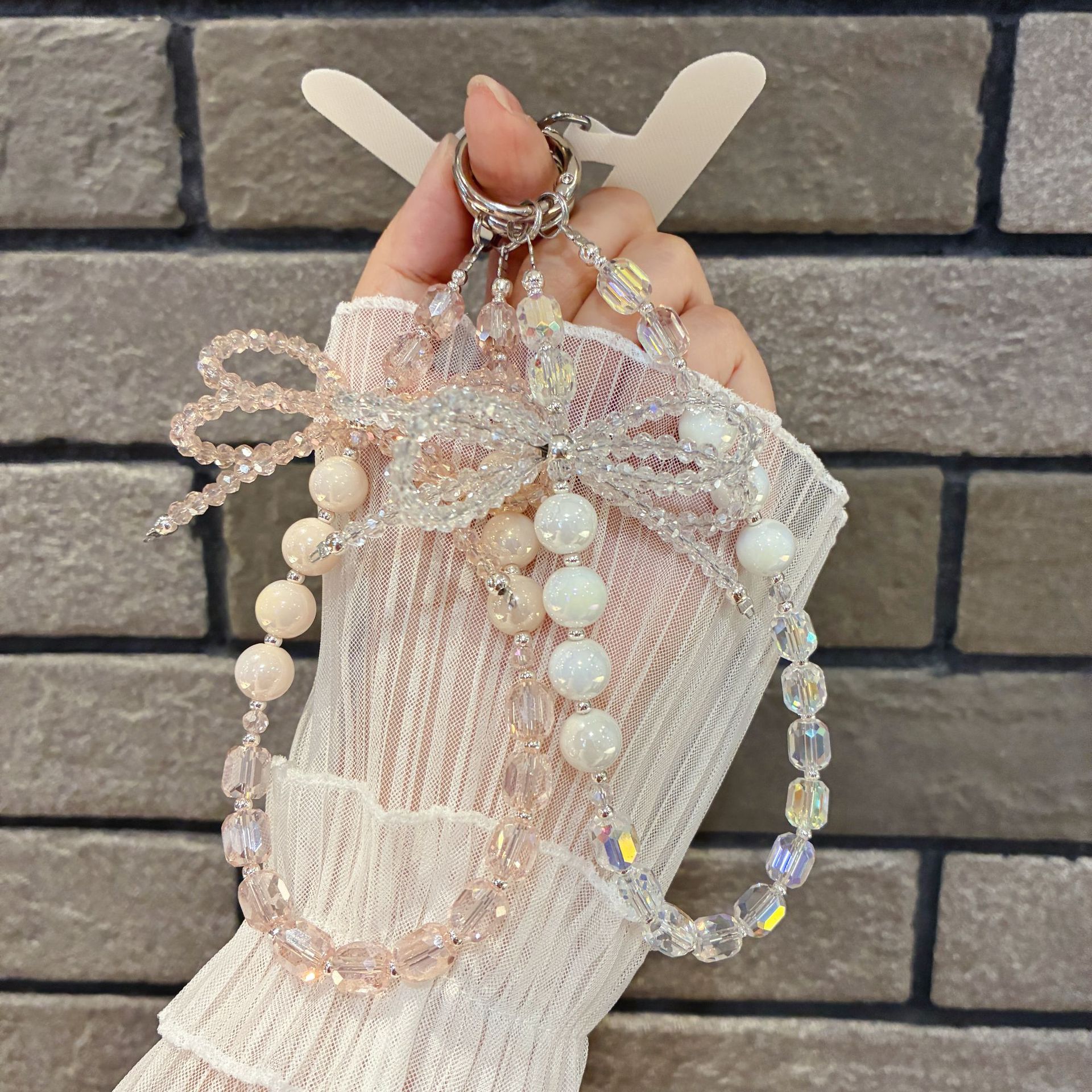 Elegant Pink & White Crystal Bow Phone Chain – INS-Inspired Anti-Slip Hanging Strap